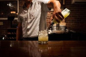 bartender pouring a drink