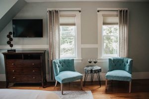 sitting area with wine glasses on the table