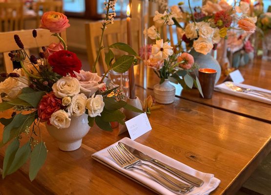 Romantic table with candle at farm to table restaurant at Squam Lake Inn