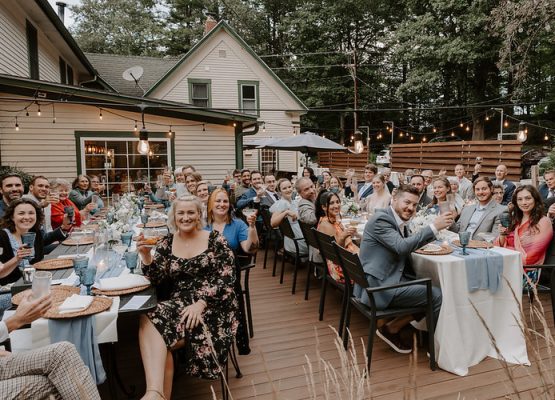 Large outdoor wedding reception at New Hampshire inn near lake