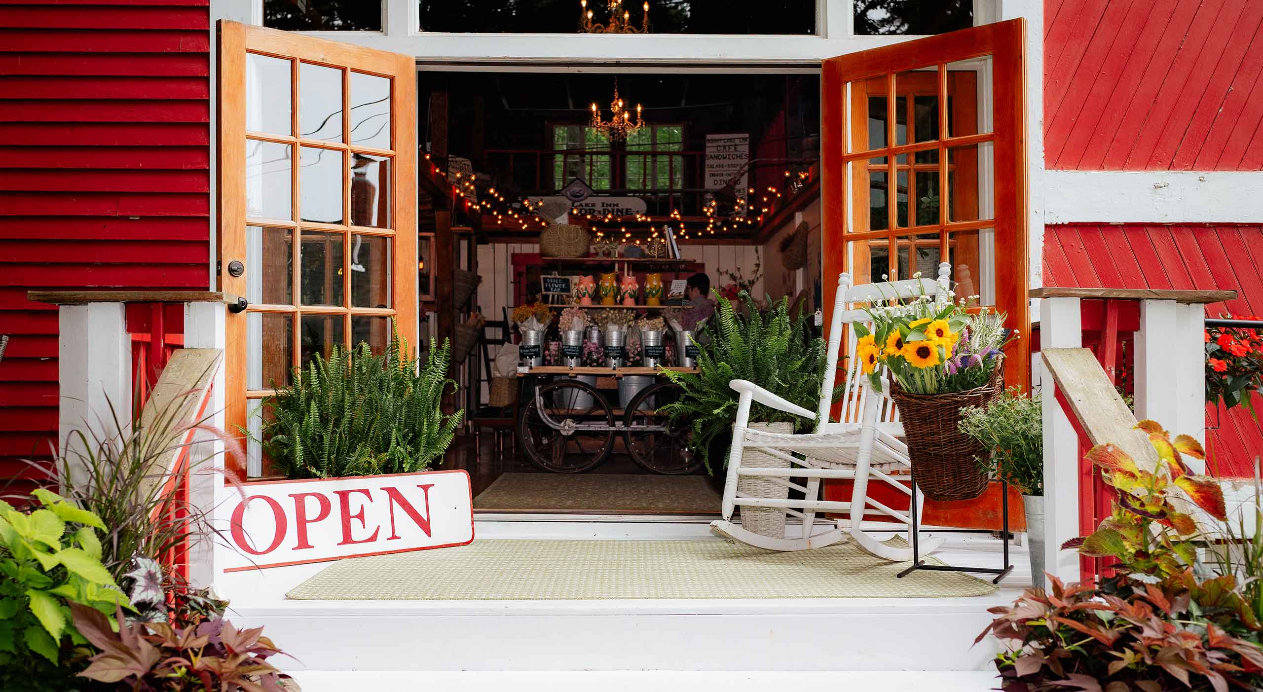 Barn INN Bloom gift & flower shop with Open sign in front