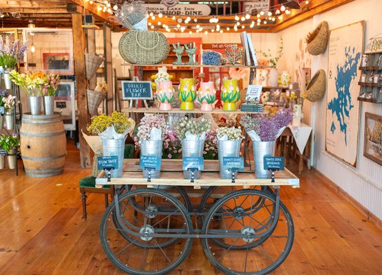 Merchandise and flowers on a cart